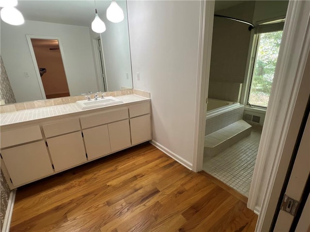 4968 Twin Branches Way, Dunwoody, GA 30338 - full bath with vanity, wood finished floors, and tiled shower / bath combo