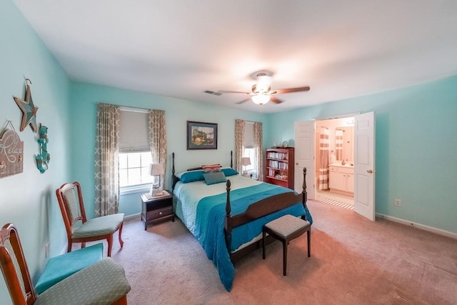 bedroom with baseboards, ceiling fan, light colored carpet, and visible vents