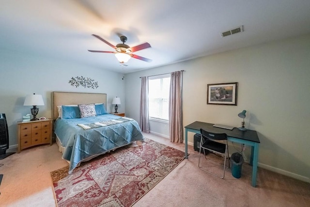 bedroom featuring visible vents, a ceiling fan, baseboards, and carpet floors