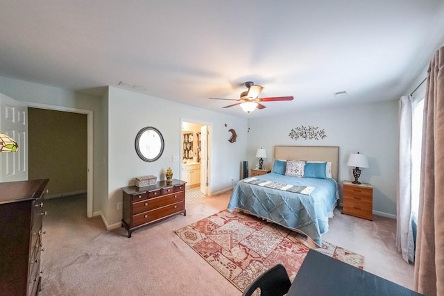 bedroom with a ceiling fan, baseboards, light colored carpet, and visible vents