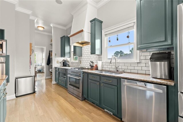 1797 Olive St SE, Atlanta, GA 30315 - kitchen featuring appliances with stainless steel finishes, a sink, green cabinetry, decorative backsplash, and stone countertops
