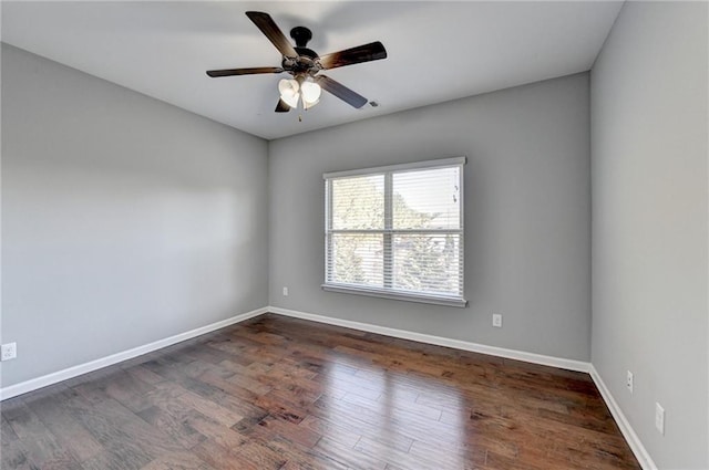 unfurnished room featuring ceiling fan and dark hardwood / wood-style floors