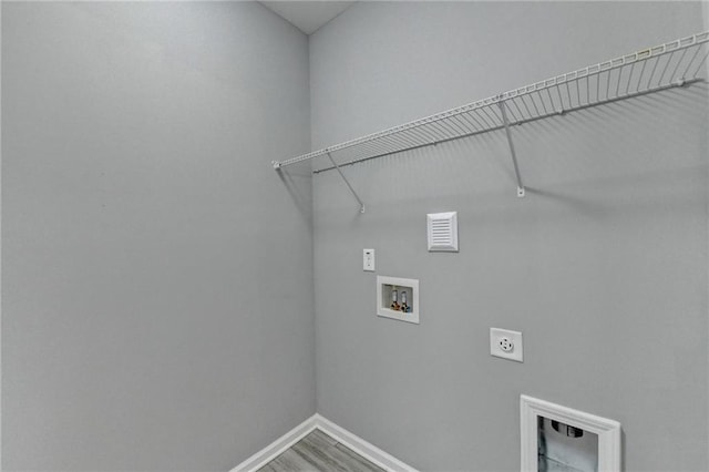 laundry room with washer hookup, hardwood / wood-style flooring, and hookup for an electric dryer