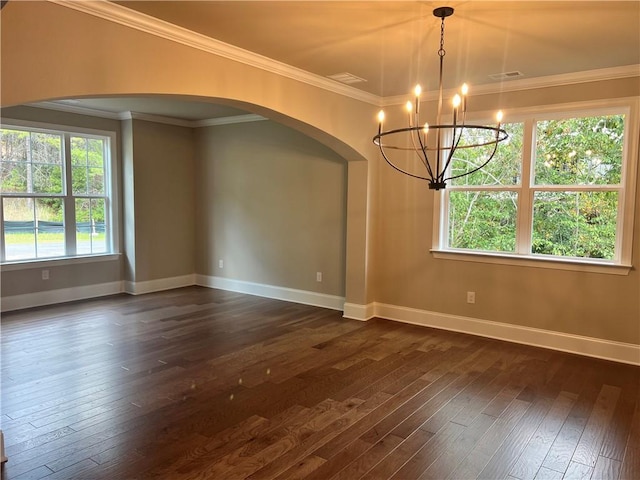 unfurnished dining area featuring dark hardwood / wood-style flooring, a chandelier, and crown molding