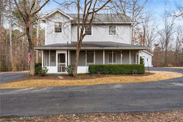 view of front of house featuring a porch and a garage