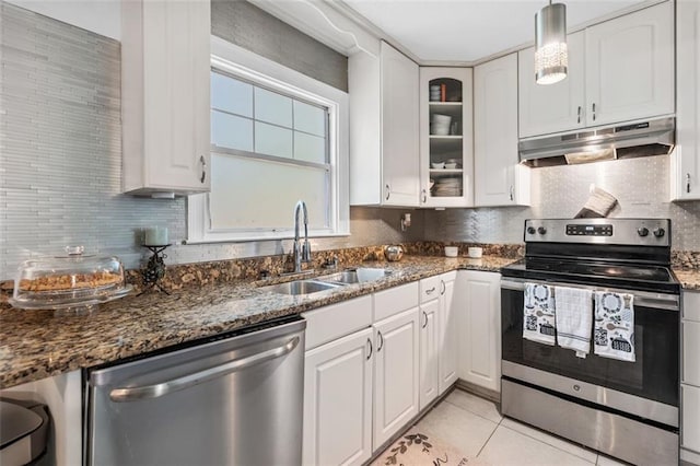 kitchen featuring light tile patterned floors, white cabinetry, a sink, appliances with stainless steel finishes, and under cabinet range hood
