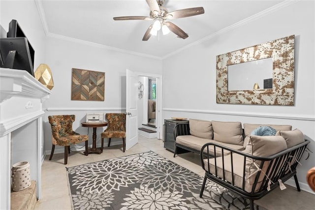 living area with light tile patterned flooring, ceiling fan, and crown molding
