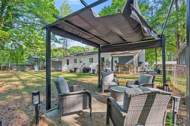view of patio with an outdoor living space and fence
