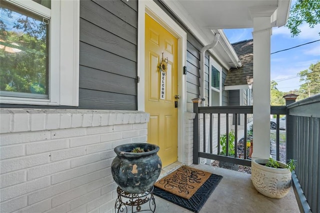 entrance to property featuring a porch