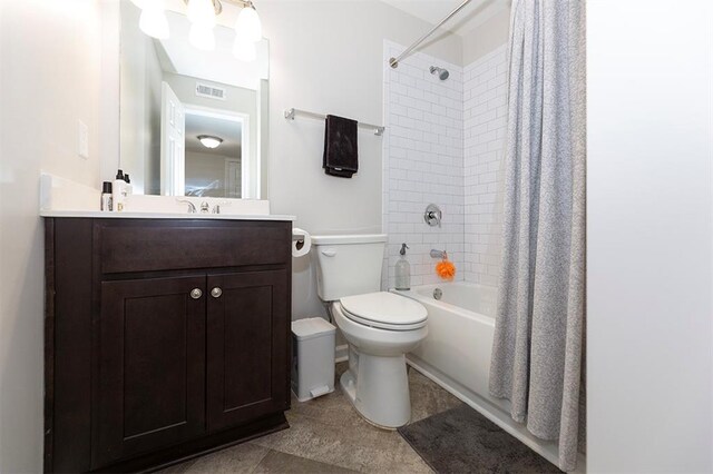 full bathroom with toilet, shower / tub combo, and vanity