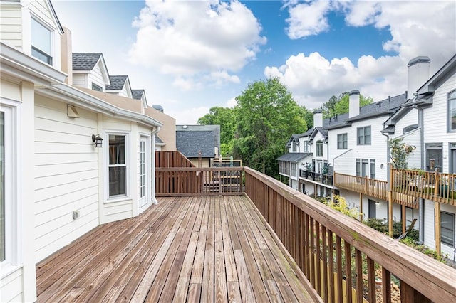 wooden terrace with a residential view