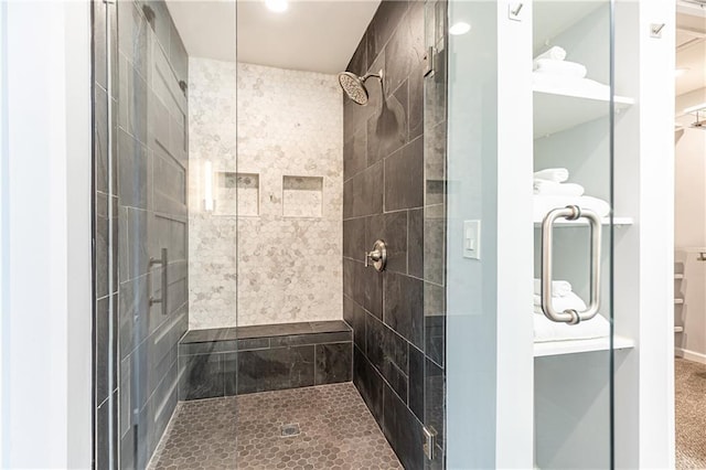 bathroom featuring recessed lighting and a stall shower