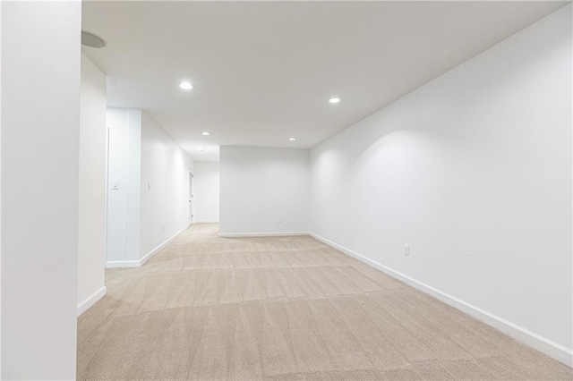 unfurnished room featuring baseboards, recessed lighting, and light colored carpet