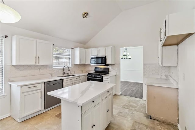 kitchen featuring white cabinetry, sink, black appliances, and a center island