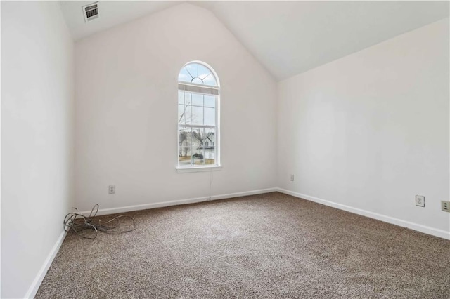 unfurnished room with lofted ceiling and carpet