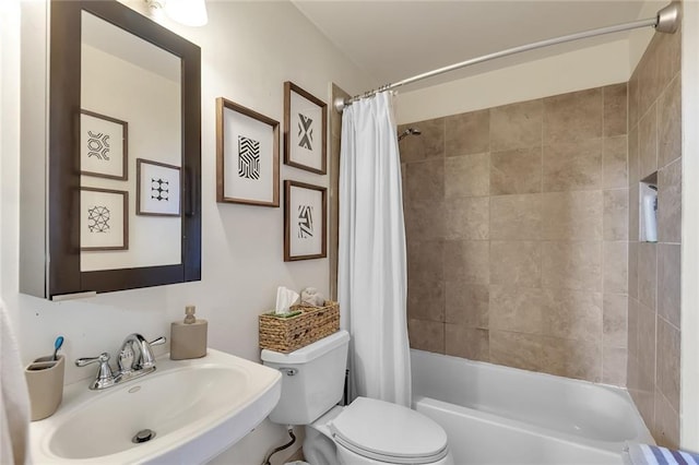 full bathroom featuring shower / bath combo, toilet, and sink