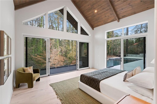 bedroom featuring wooden ceiling, access to outside, high vaulted ceiling, and light hardwood / wood-style floors