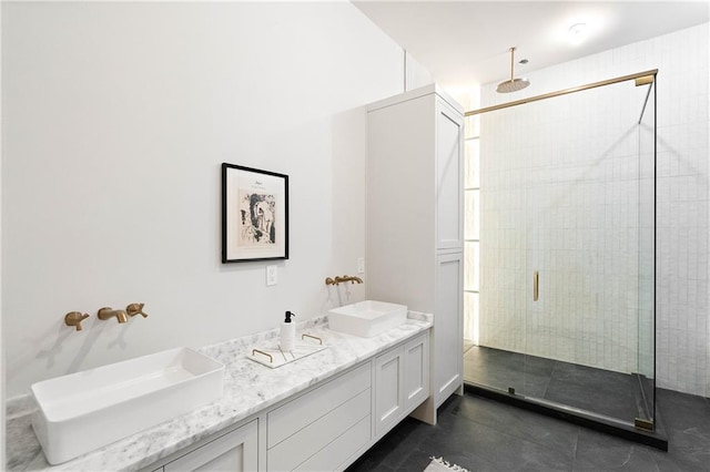 bathroom featuring vanity and an enclosed shower