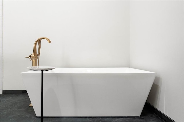 bathroom featuring a tub to relax in