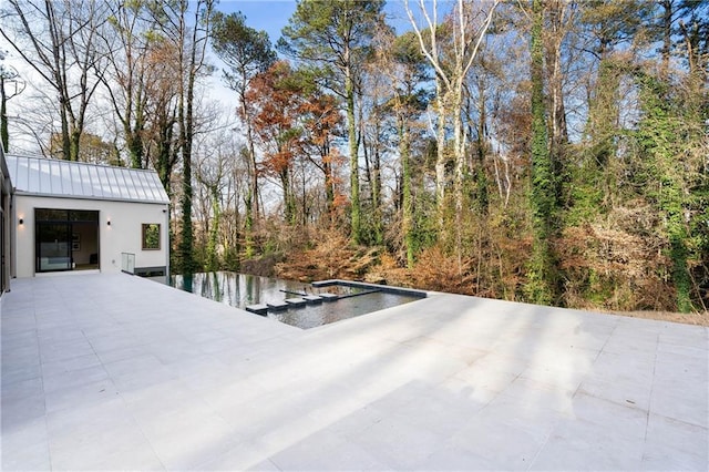 view of patio / terrace featuring a water view