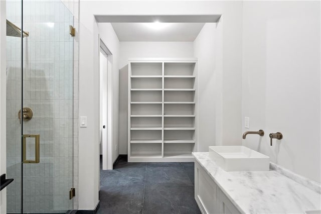 bathroom with vanity and walk in shower