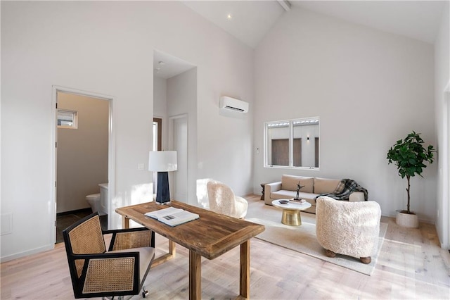 living room featuring an AC wall unit, high vaulted ceiling, and light hardwood / wood-style floors