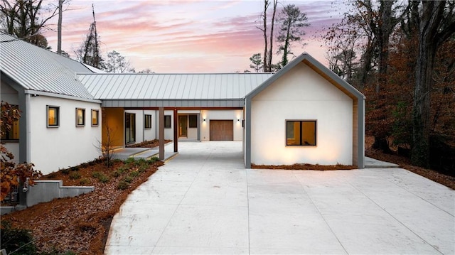 modern inspired farmhouse featuring a garage