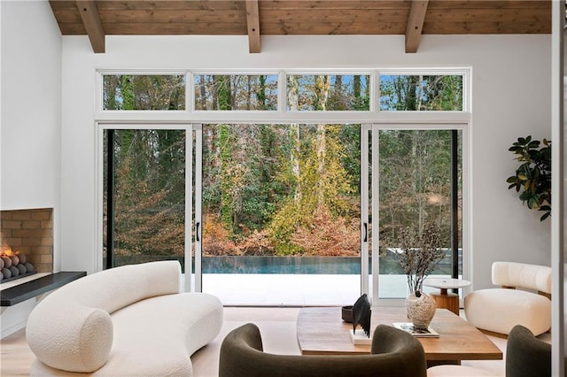 doorway to outside with beamed ceiling, wood ceiling, and wood-type flooring