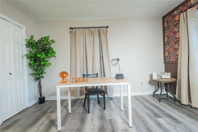 office featuring wood finished floors and baseboards