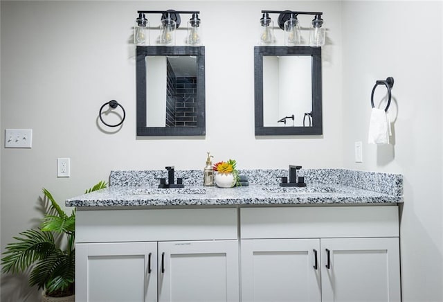 bathroom featuring double vanity and a sink