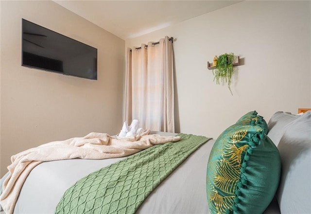 bedroom with vaulted ceiling