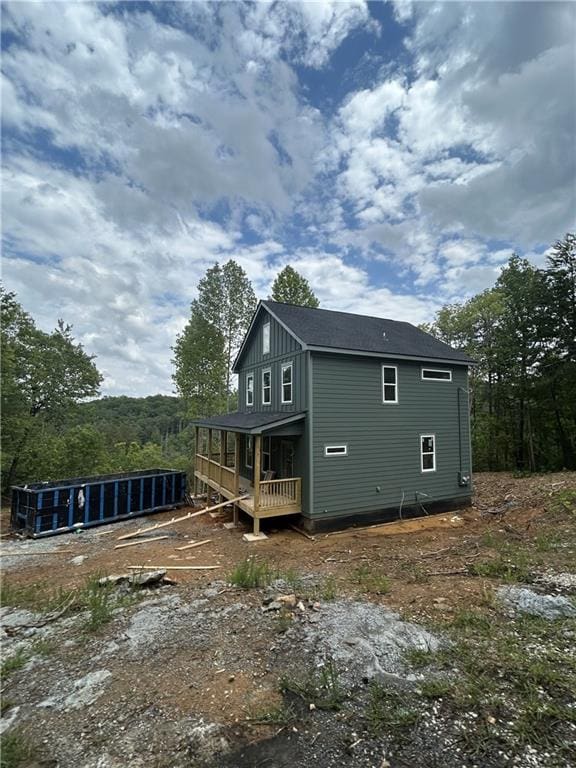 1374 Foxhound Trl NE, Ranger, GA 30734 - back of house with board and batten siding and a wooden deck