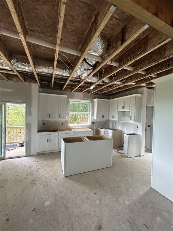 1374 Foxhound Trl NE, Ranger, GA 30734 - kitchen with white cabinetry and a kitchen island
