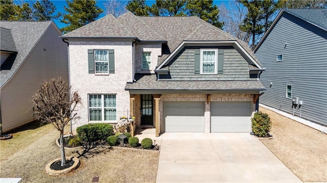 view of front of property with brick siding and a shingled roof