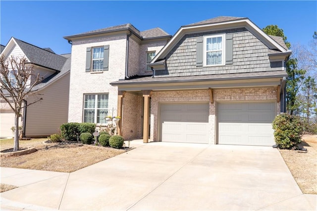 view of front of house featuring a garage, brick siding, and concrete driveway