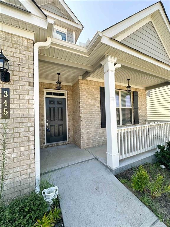 doorway to property with covered porch