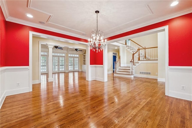 220 Spring Branch Dr, Canton, GA 30115 - unfurnished dining area featuring light wood-type flooring, ceiling fan, a chandelier, ornamental molding, and stairs