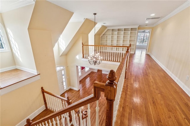 220 Spring Branch Dr, Canton, GA 30115 - hall with an upstairs landing, ornamental molding, baseboards, wood finished floors, and a chandelier