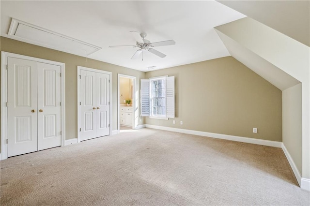 220 Spring Branch Dr, Canton, GA 30115 - unfurnished bedroom featuring attic access, light colored carpet, two closets, baseboards, and ensuite bathroom