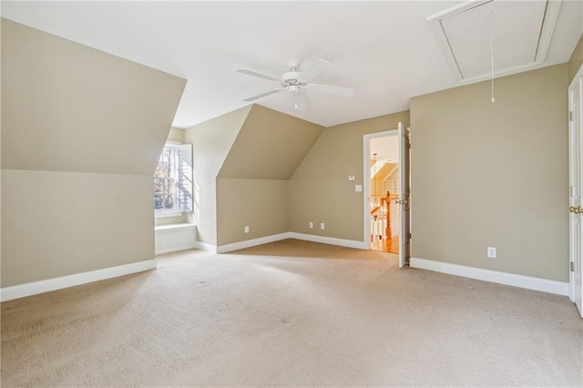 bonus room featuring light carpet, vaulted ceiling, and ceiling fan