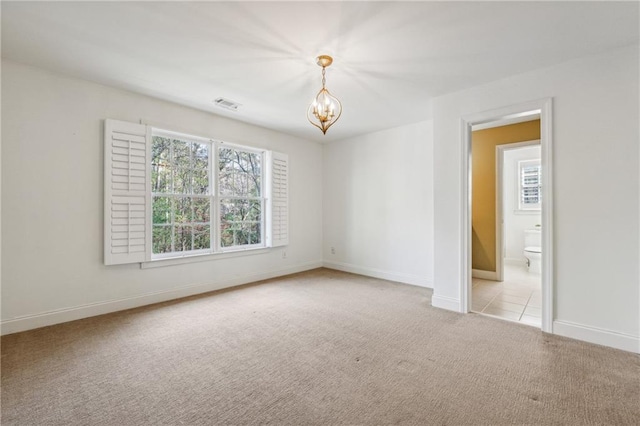 220 Spring Branch Dr, Canton, GA 30115 - carpeted spare room featuring a chandelier and baseboards