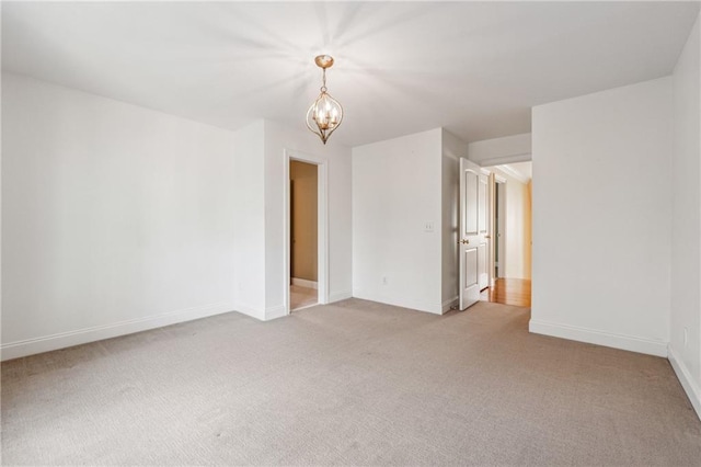 220 Spring Branch Dr, Canton, GA 30115 - spare room with light carpet, a chandelier, and baseboards