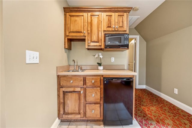 kitchen featuring sink, light tile patterned floors, black appliances, and lofted ceiling