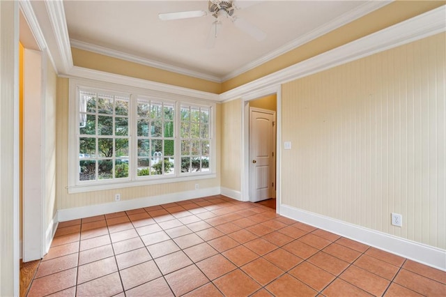 spare room featuring a wealth of natural light, crown molding, light tile patterned flooring, and ceiling fan