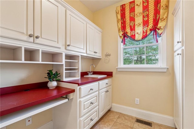 220 Spring Branch Dr, Canton, GA 30115 - washroom with a sink, baseboards, and light tile patterned flooring