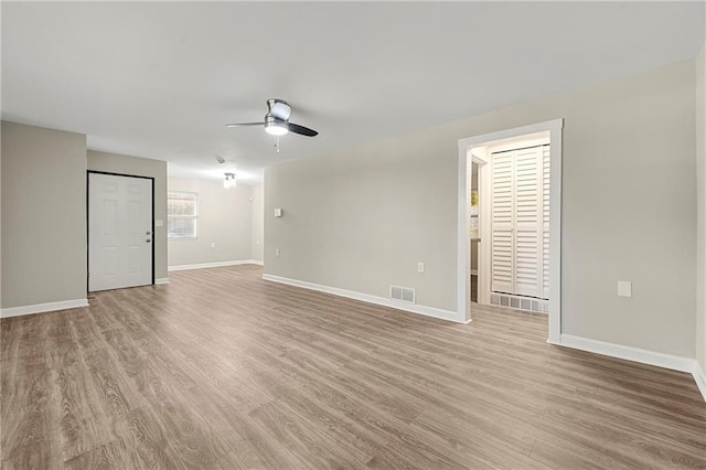 empty room featuring light hardwood / wood-style flooring and ceiling fan