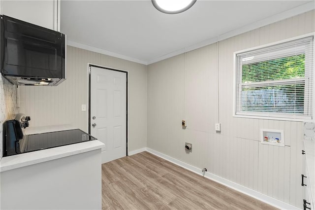 washroom with ornamental molding, electric dryer hookup, washer hookup, and light hardwood / wood-style floors