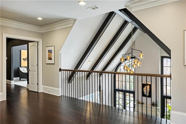 bonus room with an inviting chandelier, lofted ceiling, and dark wood-type flooring