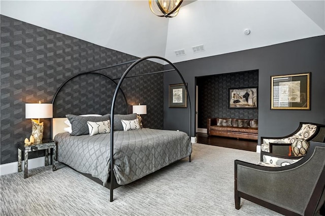 bedroom featuring high vaulted ceiling and carpet flooring