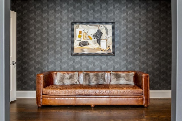 sitting room with dark wood-type flooring